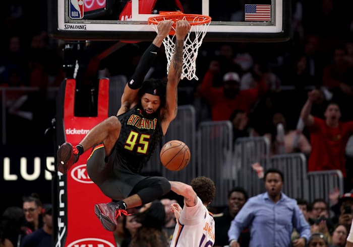 Atlanta Hawks guard DeAndre' Bembry makes a reverse dunk in the fourth quarter against the Phoenix Suns.